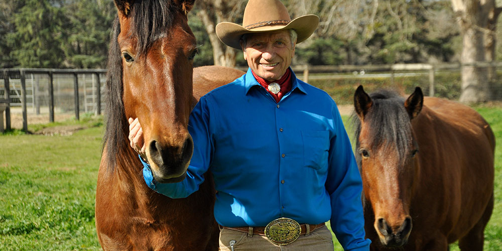 Monty Roberts at Flag Is Up Farms with Mustangs