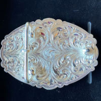 BELT BUCKLE (SMALL): MONTY ROBERTS® LOGO